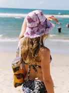 SHAPES IN THE SAND x Re/lax Remade collaboration featuring upcycled, handmade hat crafted from recycled materials, promoting slow fashion and sustainability.